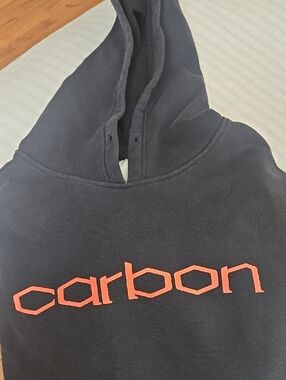 Carbon Paintball Brand Black Hoodie with Orange Logo